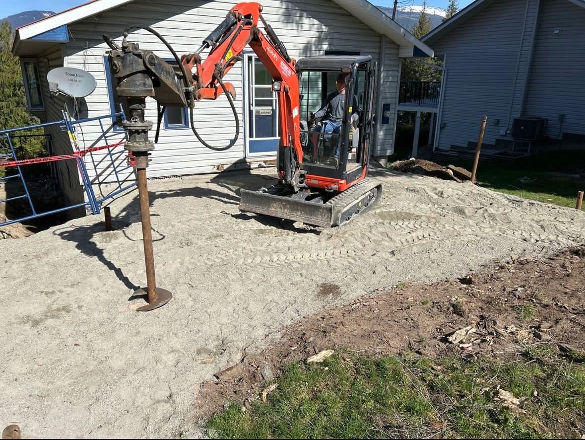 Helical piles designed and installed for a home addition to an existing house.