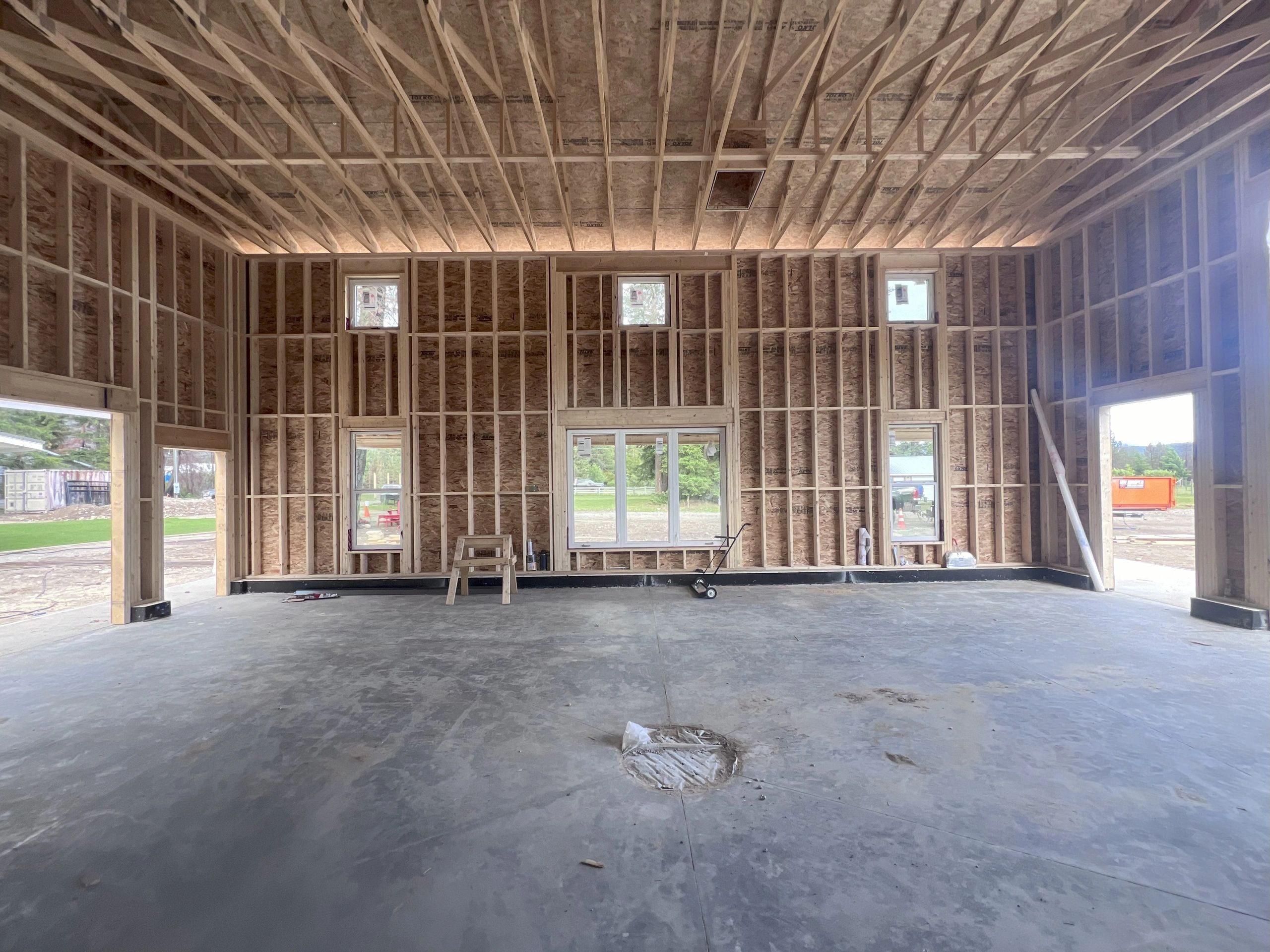 Structural engineering for a shop, including design of the thickened slab system and full framing layout.